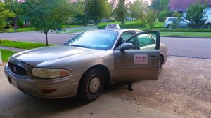 Cab Driver Roosevelt Noah waiting on his fare ride at the Clarksdale White House