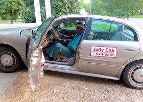 Clarksdale Taxi Cab Driver Roosevelt Noah's Jolly Cab arriving at the Clarksdale White House