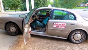 Cab Driver Roosevelt Noah's Jolly Cab arriving at the Clarksdale White House