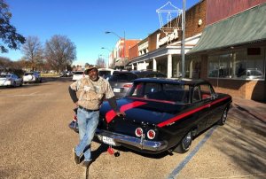 Big J Milton Johnson owner of Johnson Plumbing in Cleveland, Mississippi by his Chevy 1961 Bel Air