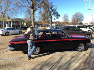 "Big J" Milton Johnson of Johnson Plumbing beside his refurbished 1961 Chevy Bel Air