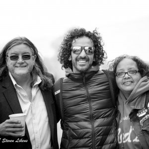 Three people smiling for a photo.