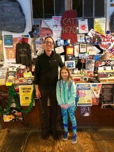 Mia meeting Roger Stolle, owner of Cat Head Delta Blues & Folk Art