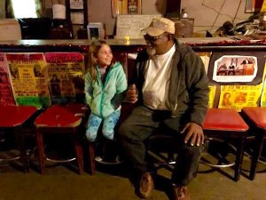 Mia meeting Red Paden inside Red's Lounge in Clarksdale