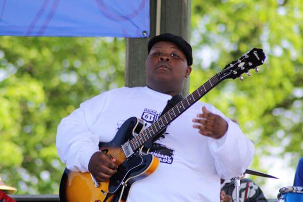 Kingfish playing bass with fellow students  from Delta Blues Museum after school education program performing on the Museum's stage