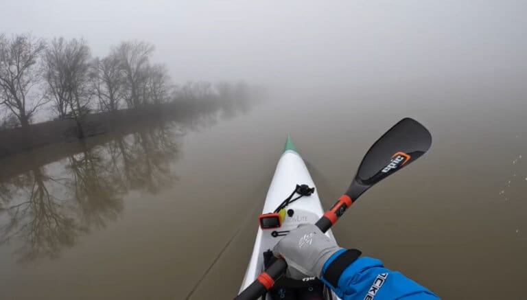 Paddling through misty waters