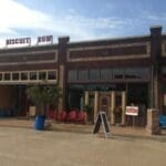 Brick building with "Biscuit Row" sign.