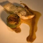Course Four Turbot with Poached and Stuffed Artichoke Heart, Champagne Sabayon, Lobster Butter Chef Romain Foubert of Numero 75, Avignon, France Pairing: 1998 J.M. Boillot, Meursault “Les Charrons” (25). Photography by Langdon Clay