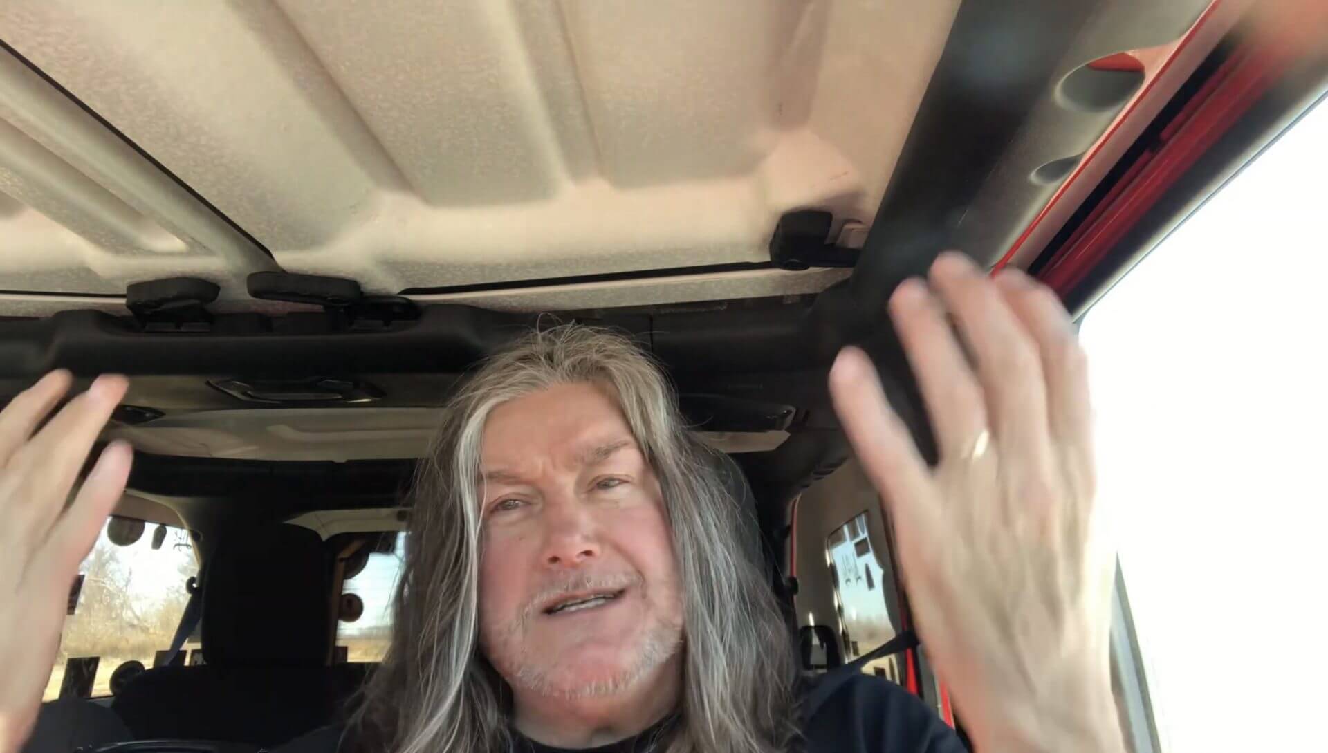 Person talking in vehicle interior