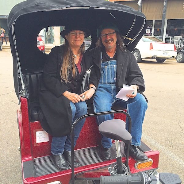 Couple sitting in a rickshaw