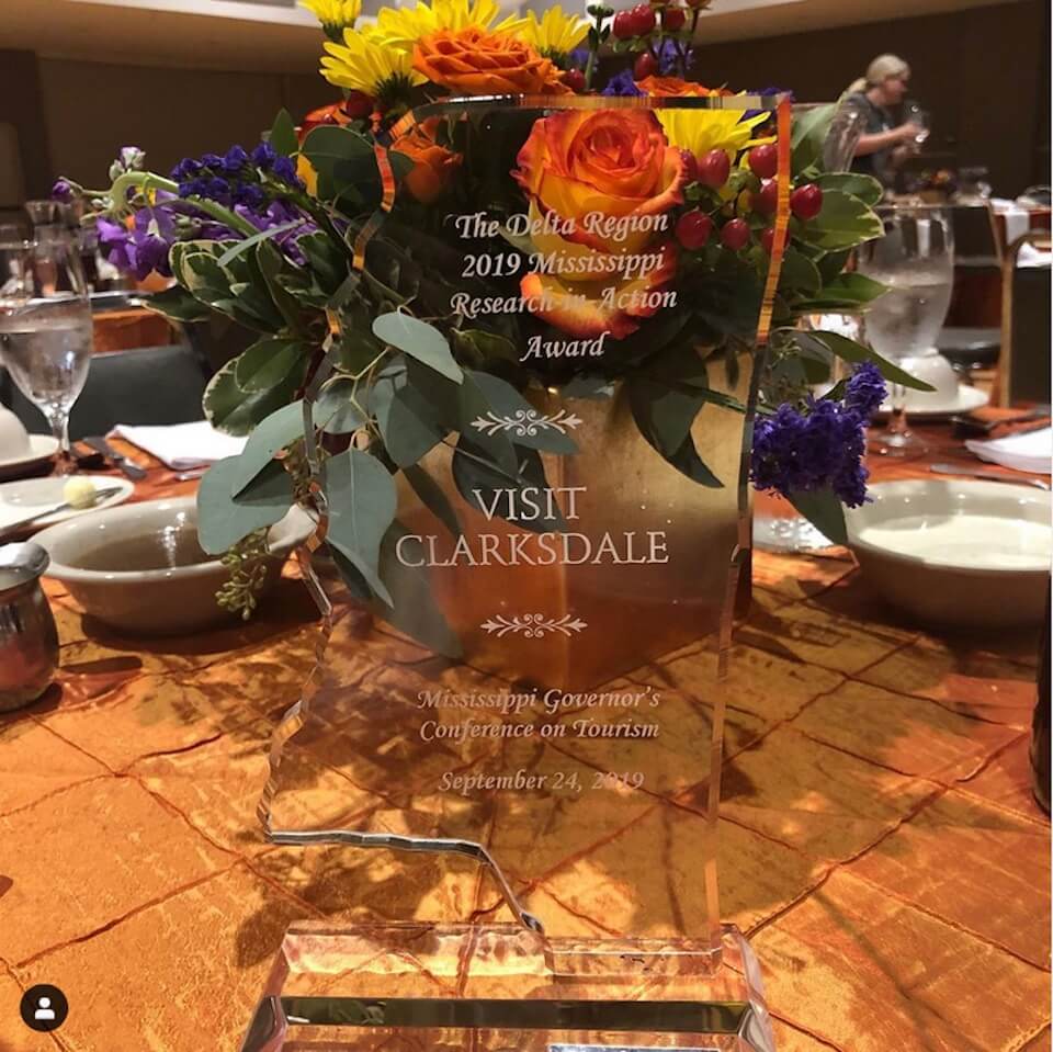 Award trophy with colorful floral arrangement