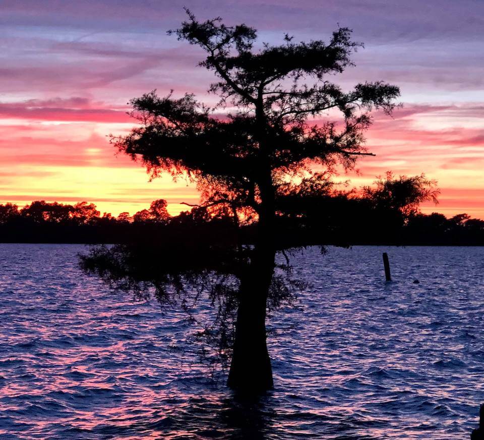 Colorful sunset reflecting on tranquil water