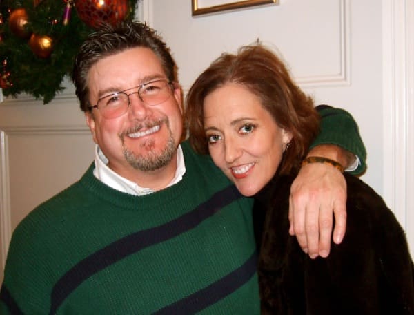 Man and woman hugging at home