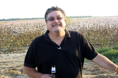 Person standing with a drink