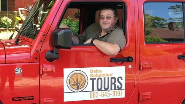 Smiling driver in tour vehicle