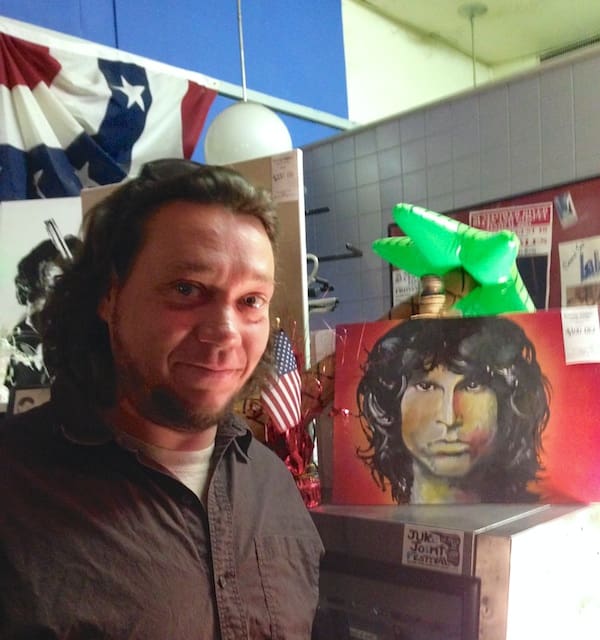 Portrait of musician near smiling man