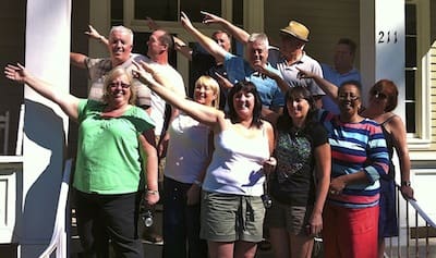 People standing together, pointing in the distance