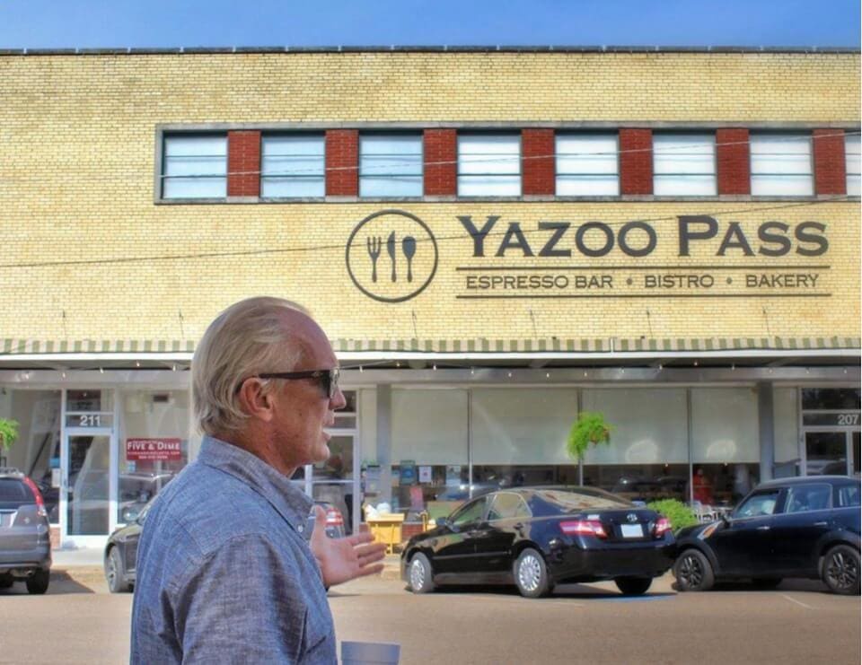 Man gesturing at Yazoo Pass building