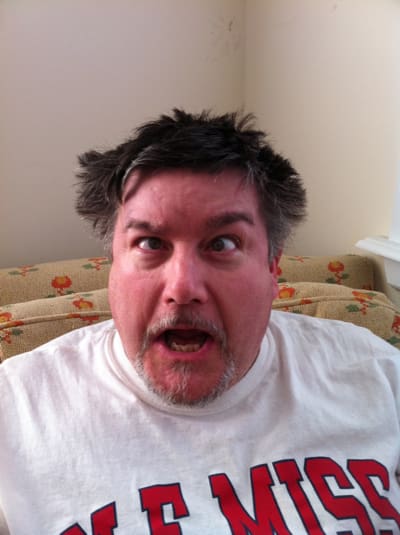 Man making a funny face indoors