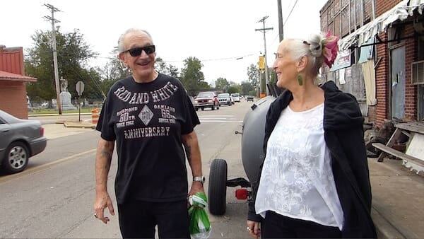 Elderly couple smiling outdoors