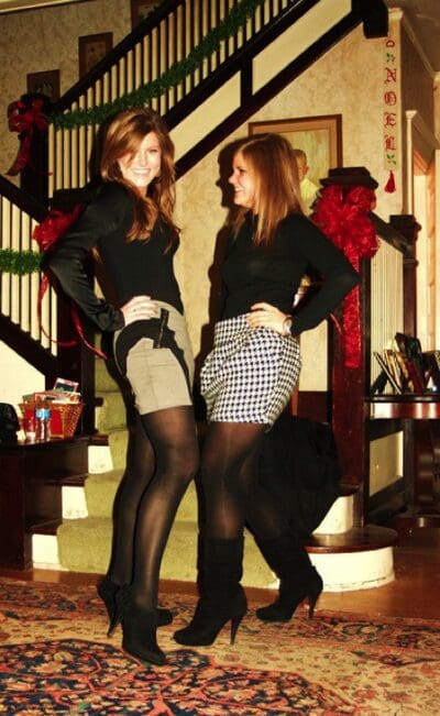 Two women posing in holiday attire
