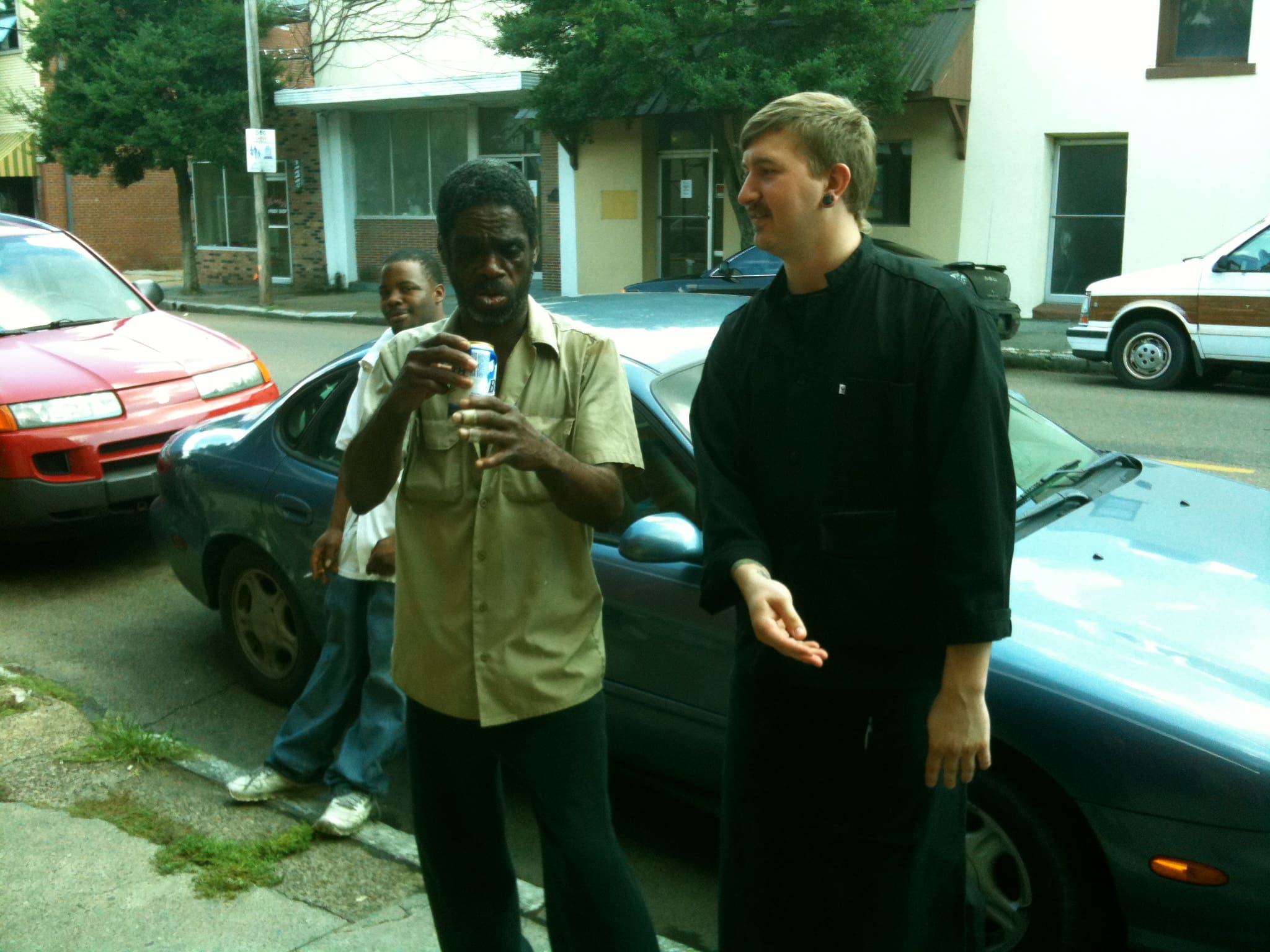 Casual street conversation between friends