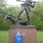 Bronze statue of a soldier and a girl.