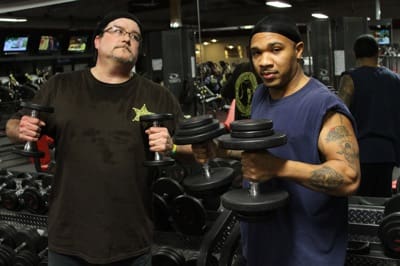 Men exercising in fitness center