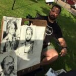 Artist sketching portraits outdoors.