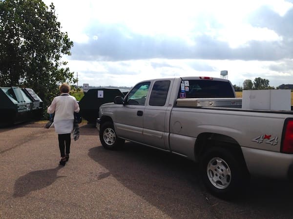 First Lady Francine Luckett taking her recyclables to the bins next to Walmart.