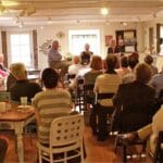 Author Curtis Wilkie talks to a crowd at TurnRow Book Company in Greenwood, MS. Photo by The Delta Bohemian