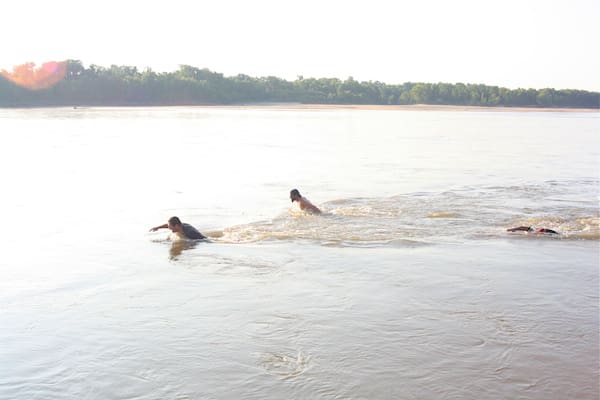 Mr. Lil John, Driftwood Johnnie and Poor William swimming in the Mississippi River