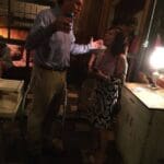 Man and woman talking in a bar.