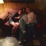 Three friends relaxing on a couch.