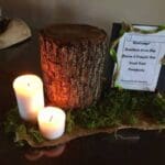 Candles, wood, and a food sign.