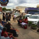 People gathered in front of a blues club.