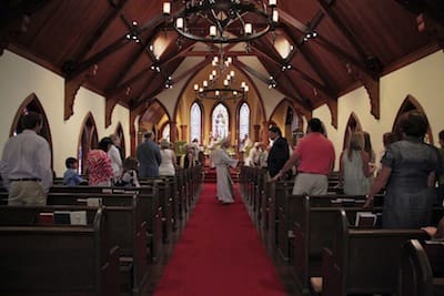 Church interior with congregation standing