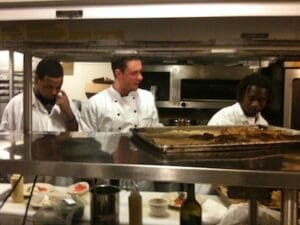 Lead Line Chef Anthony Dampier, the late Chef Levi Minyard, Sous Chef Carl Jackson, working on the line at Madidi Restaurant in Clarksdale, Mississippi. Photo by Delta Bohemian