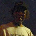 Man wearing a Dennis Piton memorial shirt.
