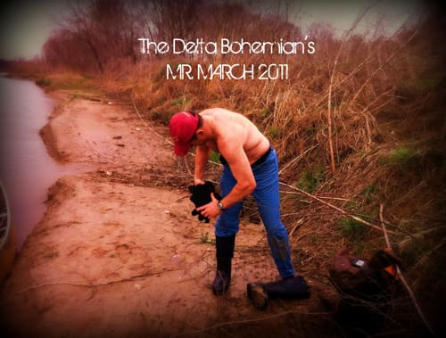 Man outdoors adjusting footwear