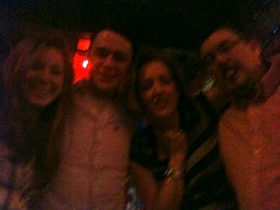 Blurry photo of four people indoors
