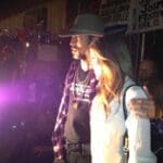 Couple posing at a music festival.