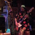 Two men playing music on stage.