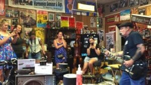 Deak Harp performing for visitors to his shop in Clarksdale