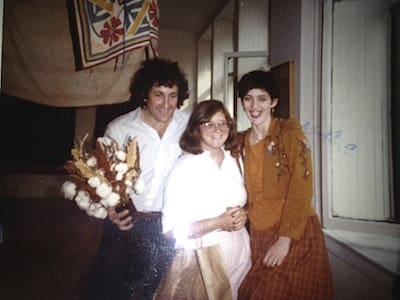 Group smiling near a window.