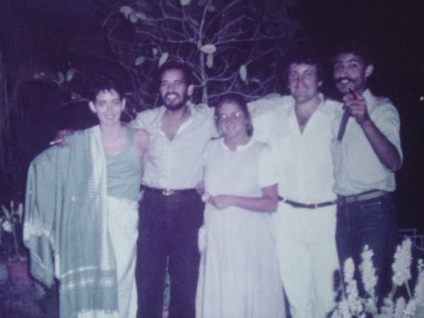 Group of five people outdoors at night