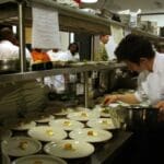 Chef Samantha Shelton from Portland, OR as she continues plating her Amuse Bouche during FRENCH NIGHT MADIDI. Photo by Rachel Bush.