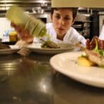 Chef Shelton finishes her plates during FRENCH NIGHT MADIDI. Photo by Rachel Bush.