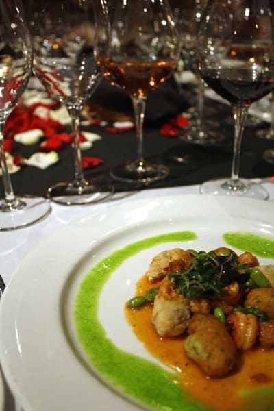 Exquisite plated meal with wine glasses