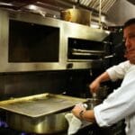 Parlor Market Executive Chef Craig Noone busy at work in the Kitchen creating his dish during FRENCH NIGHT MADIDI. Photo by Rachel Bush.